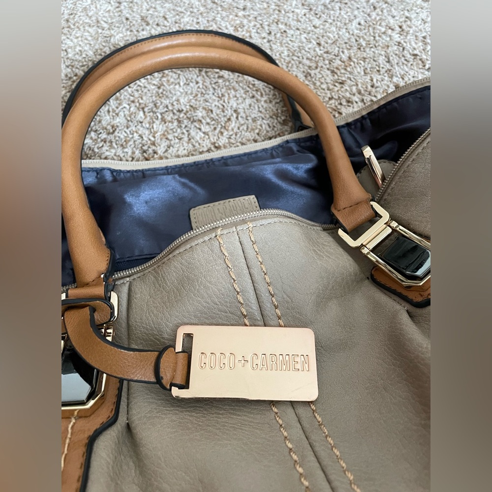 Coco and Carmen duffle. Faux leather, lots of pockets inside!